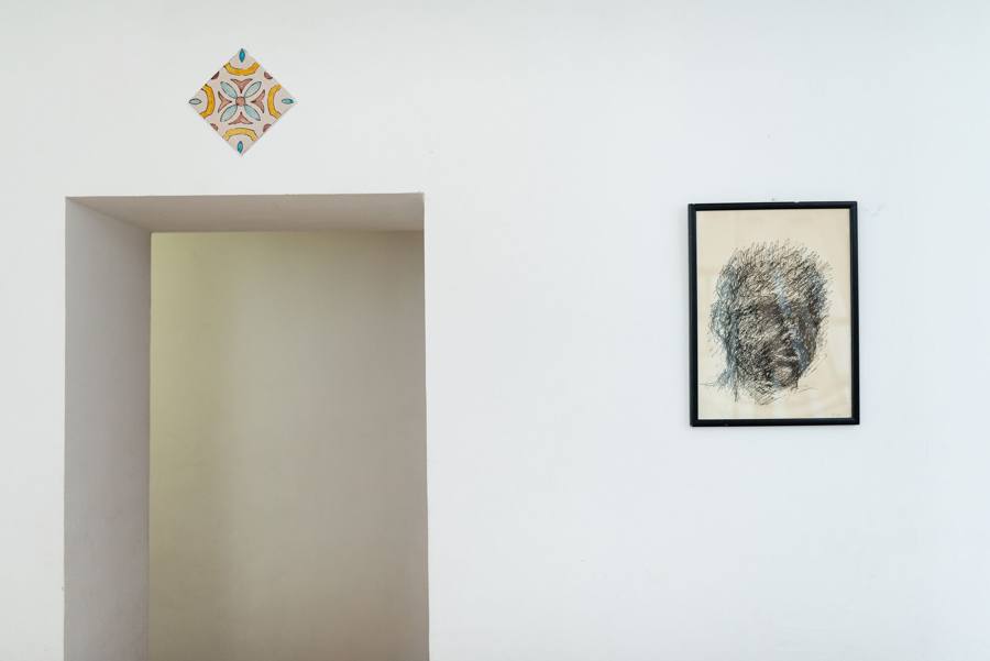 Ink portrait on the top-floor landing